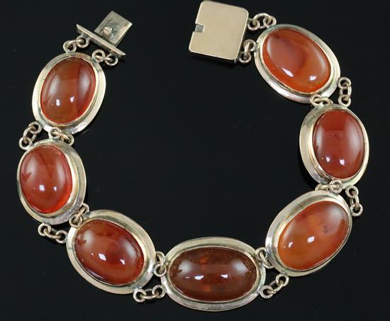 A late Victorian gold and cabochon agate set bracelet, gross 27.9 grams.